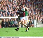 23 September 2001; Tommy Joyce of Galway in action against Cormac Murphy, left, and Paddy Reynolds of Meath during the GAA Football All-Ireland Senior Championship Final match between Galway and Meath at Croke Park in Dublin. Photo by Aoife Rice/Sportsfile