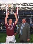 23 September 2001; Galway captain Gary Fahey celebrates with the Sam Maguire cup as President of the GAA Sean McCague looks on following the GAA Football All-Ireland Senior Championship Final match between Galway and Meath at Croke Park in Dublin. Photo by Ray McManus/Sportsfile