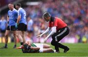 18 September 2016; Evan Regan of Mayo is attended to by Mayo team doctor Dr. Sean Moffatt during the GAA Football All-Ireland Senior Championship Final match between Dublin and Mayo at Croke Park in Dublin. Photo by Brendan Moran/Sportsfile