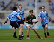 18 September 2016; Toby Lee Curran, St. Ernans BNS, Rathnew, Co. Wicklow, representing Mayo, in action against Donal Sheehan, Glenville N.S, Glenville, Co. Cork, representing Dublin, during the INTO Cumann na mBunscol GAA Respect Exhibition Go Games at the GAA Football All-Ireland Senior Championship Final match between Dublin and Mayo at Croke Park in Dublin. Photo by Seb Daly/Sportsfile