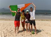 18 September 2016; Team Ireland members, from left to right, Jason Smyth, Greta Streimikyte, Orla Comerford, and Michael McKillop, on the Copacabana beach where they gathered to support Patrick Monahan of Ireland, during the T54 Men's Marathon at Fort Copacabana during the Rio 2016 Paralympic Games in Rio de Janeiro, Brazil. Photo by Diarmuid Greene/Sportsfile
