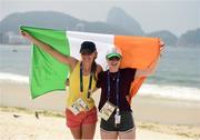 18 September 2016; Greta Streimikyte, left, and Orla Comerford of Ireland on the Copacabana beach where they gathered to support Patrick Monahan of Ireland, during the T54 Men's Marathon at Fort Copacabana during the Rio 2016 Paralympic Games in Rio de Janeiro, Brazil. Photo by Diarmuid Greene/Sportsfile