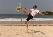 18 September 2016; Michael McKillop of Ireland plays football on the Copacabana beach where he and team-mates gathered to support Patrick Monahan of Ireland, during the T54 Men's Marathon at Fort Copacabana during the Rio 2016 Paralympic Games in Rio de Janeiro, Brazil. Photo by Diarmuid Greene/Sportsfile