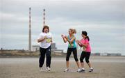 26 January 2011; Leinster and Ireland rugby great Shane Byrne gets some encouragement from RTE Sport's Evanne Ni Chuilinn and 2FM's Louise Heraghty, right, as he prepares for the Great Ireland Run 2011 in the Phoenix Park, Dublin, on Sunday April10th. Great Ireland Run 2011 photocall, Sandymount Strand, Sandymount, Dublin. Picture credit: Brendan Moran / SPORTSFILE