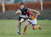 26 January 2011; Robbie Mullen, Newbridge College, is tackled by Killian Roche, De La Salle Churchtown. Powerade Leinster Schools Rugby Vinnie Murray Cup 2nd Round, Newbridge College v De La Salle Churchtown, Sydney Parade, Dublin. Picture credit: Barry Cregg / SPORTSFILE