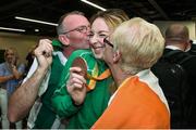 21 September 2016; Paralympic bronze medallist Ellen Keane with her father Eddie and mother Laura at the homecoming from the Rio 2016 Paralympic Games at Dublin Airport in Dublin. Photo by Matt Browne/Sportsfile