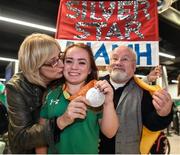 21 September 2016; Paralympic silver medallist Niamh McCarthy with her mother Caroline and father Flor at the homecoming from the Rio 2016 Paralympic Games at Dublin Airport in Dublin. Photo by Matt Browne/Sportsfile