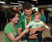 21 September 2016; Cyclist Eoghan Clifford from Galway, shows his gold and bronze medals to his 11-month-old daughter Zofia Clifford and wife Magdalena Hajdukiewicz during their homecoming from the Rio 2016 Paralympic Games at Dublin Airport in Dublin. Photo by Cody Glenn/Sportsfile