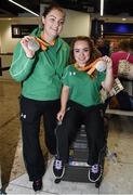21 September 2016; Orla Barry, left, from  Ladysbridge, Co Cork, who won silver in the Women's Discus F57 Final, and Niamh McCarthy, from Carrigaline, Co Cork, who won silver in the Women's Discus Throw F41 Final, display their medals during their homecoming from the Rio 2016 Paralympic Games at Dublin Airport in Dublin. Photo by Cody Glenn/Sportsfile