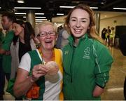 21 September 2016; Swimmer Ellen Keane, from Clontarf, Co Dublin, who won bronze in the Women's 100m Breaststroke SB8 Final, with her mother Laura Keane holding her bronze medal during their homecoming from the Rio 2016 Paralympic Games at Dublin Airport in Dublin. Photo by Cody Glenn/Sportsfile