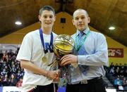 27 January 2011; Conor Lilly, Competitions Co-ordinator, Basketball Ireland, presents Cillian Lane, Colaiste Mhuire, Crosshaven, Cork, with the MVP award. Basketball Ireland Boys U16B Schools Cup Final, Colaiste Mhuire, Crosshaven, Cork v St. Muredach's, Ballina, Co. Mayo, National Basketball Arena, Tallaght, Dublin. Picture credit: Brian Lawless / SPORTSFILE