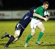 28 January 2011; Gavin Duffy, Ireland Wolfhounds, is tackled by Frazer McKenzie, Scotland A. Friendly International, Scotland A v Ireland Wolfhounds, Netherdale, Gala Shields, Scotland. Picture credit: Craig Watson / SPORTSFILE