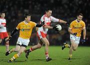 29 January 2011; James Conway, Derry, in action against Justin Crozier, Antrim. Barrett Sports Lighting Dr. McKenna Cup Semi-Final, Derry v Antrim, Celtic Park, Derry. Picture credit: Oliver McVeigh / SPORTSFILE
