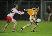 29 January 2011; Kevin Brady, Antrim, in action against Ciaran McGoldrick, Derry. Barrett Sports Lighting Dr. McKenna Cup Semi-Final, Derry v Antrim, Celtic Park, Derry. Picture credit: Oliver McVeigh / SPORTSFILE