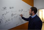 23 September 2016; Leinster's Robbie Henshaw signs the wall at the Laighin Out Supporters Bar before a Q&A session following the Guinness PRO12, Round 4, match between Leinster and Ospreys at the RDS Arena in Dublin. Photo by Stephen McCarthy/Sportsfile