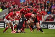 24 September 2016; John Ryan of Munster is tackled by Magnus Bradbury, left, and Stuart McInally of Edinburgh Rugby during the Guinness PRO12 Round 4 match between Munster and Edinburgh Rugby at Thomond Park in Limerick. Photo by Diarmuid Greene/Sportsfile
