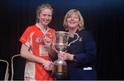 24 September 2016; Louise Divilly, captain of Kilkerrin Clonberne, Galway, is presented with the Senior Championship trophy by LGFA President Marie Hickey at the Ladies Football All-Ireland Senior Club Sevens at Naomh Mearnóg GAA in Portmarnock, Dublin. Photo by Piaras Ó Mídheach/Sportsfile