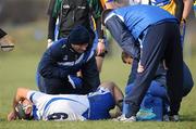 30 January 2011; Waterford's Eoin McGrath receives medical attention after picking up an ankle injury during the first half. Waterford Crystal Cup Semi-Final, Clare v Waterford, Sixmilebridge GAA Club, Sixmilebridge, Co. Clare. Picture credit: Diarmuid Greene / SPORTSFILE