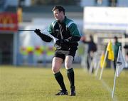 30 January 2011; Linesman David Hughes fixes his flag after dropoing it during the game. AIB Leinster GAA Hurling Senior Club Championship Final, O'Loughlin Gaels v Oulart the Ballagh, Dr. Cullen Park, Carlow. Picture credit: Matt Browne / SPORTSFILE