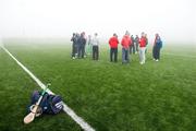 23 January 2011; Members of the NUI Galway team await the outcome of a pitch inspection during fog. Walsh Cup, Kilkenny v NUI Galway, St Patriclk's GAA Club, Ballyragget, Co Kilkenny. Picture credit: Ray McManus / SPORTSFILE