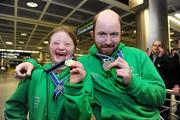 30 January 2011; Team Ireland's Gary Burton, from  Sallynoggin, Co. Dublin, right, who won gold in the Giant Slalom and silver in the Slalom, and Clara Keogan, from Ballsbridge, Dublin, who won bronze in the Giant Slalom and fourth in the Slalom, return to Dublin Airport following the Special Olympics European Ski Alpine Cup 2011 in Austria. Dublin Airport, Dublin. Picture credit: Brian Lawless / SPORTSFILE