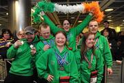 30 January 2011; Team Ireland members, from left, Gary Burton, from Sallynoggin, Co. Dublin, who won gold in the Giant Slalom and silver in the Slalom, Ben Purcell, from Dalkey, Co. Dublin, who came fourth in the Giant Slalom and fouth in the Slalom, Clara Keogan, from Ballsbridge, Co. Dublin, who won bronze in the Giant Slalom and fourth in the Slalom, Lorraine Whelan, from Delgany, Co. Wicklow, who won gold in the Giant Slalom, Katherine Daly, from Dalkey, Co. Dublin, who won silver in the Giant Slalom and gold in the Slalom, and Cormac Maguire, from Ballinteer, Co. Dublin, who won gold in the Slalom and fourth in the Giant Slalom, return to Dublin Airport following the Special Olympics European Ski Alpine Cup 2011 in Austria. Dublin Airport, Dublin. Picture credit: Brian Lawless / SPORTSFILE