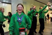 30 January 2011; Team Ireland's Clara Keogan, from Ballsbridge, Co. Dublin, who won bronze in the Giant Slalom and fourth in the Slalom, with team-mates on their return to Dublin Airport following the Special Olympics European Ski Alpine Cup 2011 in Austria. Dublin Airport, Dublin. Picture credit: Brian Lawless / SPORTSFILE