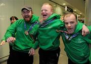 30 January 2011; Team Ireland members, from left, Gary Burton, from Sallynoggin, Co. Dublin, who won gold in the Giant Slalom and silver in the Slalom, Ben Purcell, from Dalkey, Co. Dublin, who came fourth in the Giant Slalom and fourth in the Slalom, and Cormac Maguire, from Ballinteer, Co. Dublin, who won gold in the Slalom and fourth in the Giant Slalom, on their return to Dublin following the Special Olympics European Ski Alpine Cup 2011 in Austria. Dublin Airport, Dublin. Picture credit: Brian Lawless / SPORTSFILE
