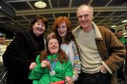 30 January 2011; Team Ireland's Katherine Daly, from Dalkey, Co. Dublin, who won silver in the Giant Slalom and gold in the Slalom, with her parents Ann and Ian Daly and her sister Anna, on her return to Dublin following the Special Olympics European Ski Alpine Cup 2011 in Austria. Dublin Airport, Dublin. Picture credit: Brian Lawless / SPORTSFILE