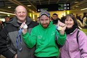 30 January 2011; Team Ireland's Gary Burton, from Sallynoggin, Co. Dublin, who won gold in the Giant Slalom and silver in the Slalom, with his parents Michael and Mary Burton, on their return to Dublin following the Special Olympics European Ski Alpine Cup 2011 in Austria. Dublin Airport, Dublin. Picture credit: Brian Lawless / SPORTSFILE