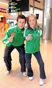 31 January 2011; Ireland's Catherine Wayland, from New Ross, Co. Wexford, who won Gold in the Women's Discus F51 and Silver in the Women's Club Throw with Michael McKillop, from Co. Antrim, who won a Gold Medal after winning the Men's 800m T37 and also won the 1,500m final on their arrival into to Dublin following the 2011 IPC Athletics World Championships in New Zealand. Dublin Airport, Dublin. Picture credit: Ray McManus / SPORTSFILE