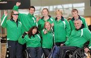 31 January 2011; Ireland's Nadine Lattimore, from Baldoyle, Dublin, Michael McKillop, from Co. Antrim, Orla Barry, from Ladysbridge, Cork, Ailish Dunne, Mountmellick, Co. Laois, Ray O'Dwyer, from Hugginstown, Kilkenny, with in front, Rosemary Tallon, from Drogheda, Co. Louth, Catherine Wayland, from New Ross, Co. Wexford, and Garrett Culliton, from Clonaslee, Co. Laois, on their arrival into Dublin following the 2011 IPC Athletics World Championships in New Zealand. Dublin Airport, Dublin. Picture credit: Ray McManus / SPORTSFILE