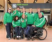 31 January 2011; Ireland's Nadine Lattimore, from Baldoyle, Dublin, Michael McKillop, from Co. Antrim, Orla Barry, from Ladysbridge, Cork, Ailish Dunne, Mountmellick, Co. Laois, Ray O'Dwyer, from Hugginstown, Kilkenny, with in front, Rosemary Tallon, from Drogheda, Co. Louth, Catherine Wayland, from New Ross, Co. Wexford, and Garrett Culliton, from Clonaslee, Co. Laois, on their arrival into Dublin following the 2011 IPC Athletics World Championships in New Zealand. Dublin Airport, Dublin. Picture credit: Ray McManus / SPORTSFILE