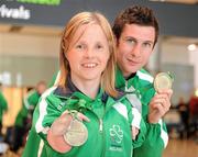 31 January 2011; Ireland's Catherine Wayland, from New Ross, Co. Wexford, who won Gold in the Women's Discus F51 and Silver in the Women's Club Throw with Michael McKillop, from Co. Antrim, who won a Gold Medal after winning the Men's 800m T37 and also won the 1,500m final on their arrival into Dublin following the 2011 IPC Athletics World Championships in New Zealand. Dublin Airport, Dublin. Picture credit: Ray McManus / SPORTSFILE