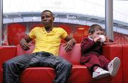 31 January 2011; Willie Casey's son, Terry, aged 4, drinks a cup of tea alongside Guillermo Rigondeaux before a press conference ahead of their WBA Super Bantamweight World Title Fight on March 19th in Citywest Convention Centre, Dublin. WBA Super Bantamweight World Title Fight Press Conference, Thomond Park, Limerick. Picture credit: Diarmuid Greene / SPORTSFILE