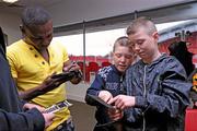 31 January 2011; Guillermo Rigondeaux signs autographs for brothers Edward, aged 11, left, and Paddy Donovan, aged 12, from Ennis, Co. Clare, both members of Our Lady of Lourdes Boxing Club, before a press conference ahead of their WBA Super Bantamweight World Title Fight on March 19th in Citywest Convention Centre, Dublin. WBA Super Bantamweight World Title Fight Press Conference, Thomond Park, Limerick. Picture credit: Diarmuid Greene / SPORTSFILE