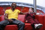 31 January 2011; Willie Casey's son, Terry, aged 4, shares a laugh with Guillermo Rigondeaux before a press conference ahead of their WBA Super Bantamweight World Title Fight on March 19th in Citywest Convention Centre, Dublin. WBA Super Bantamweight World Title Fight Press Conference, Thomond Park, Limerick. Picture credit: Diarmuid Greene / SPORTSFILE
