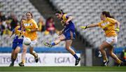 25 September 2016; Emer Heaney of Longford scores her side's second goal despite the best efforts of Emma Kelly, left, and Stephanie Cochrane of Antrim during the TG4 Ladies Football All-Ireland Junior Football Championship Final match between Antrim and Longford at Croke Park in Dublin.  Photo by Brendan Moran/Sportsfile