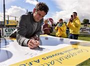 25 September 2016; Former Republic of Ireland Keith Andrews signs a congratulation board during the Aviva FAI Club of the Year Community Day with Shiven Rovers at Newbridge in Co. Galway Photo by David Maher/Sportsfile