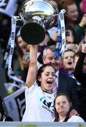 25 September 2016; Kildare captain Aisling Holton lifts the cup with the help of Kildare supporter Jennifer Malone after the TG4 Ladies Football All-Ireland Intermediate Football Championship Final match between Clare and Kildare at Croke Park in Dublin.  Photo by Brendan Moran/Sportsfile