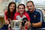26 September 2016; Mary O'Donovan, age 13, from Ballygarvan, Cork, with Cork captain Ciara O'Sullivan and manager Ephie Fitzgerald and the Brendan Martin cup during a visit to Our Lady's Children's Hospital, Crumlin, in Dublin. Photo by Piaras Ó Mídheach/Sportsfile