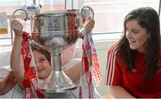 26 September 2016; Ciara Ashman, age 10, and member of Inch Rovers GAA club in Cork, with Cork captain Ciara O'Sullivan with the Brendan Martin cup during a visit to Our Lady's Children's Hospital, Crumlin, in Dublin. Photo by Piaras Ó Mídheach/Sportsfile