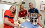 26 September 2016; Bridget McDonagh, age 8 weeks, from Dublin, with Cork manager Ephie Fitzgerald and players Vera Foley, left, and Bríd Stack with the Brendan Martin cup during a visit to Temple Street Children's Hospital, in Dublin. Photo by Piaras Ó Mídheach/Sportsfile