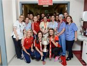 26 September 2016; Cork players and nursing staff with the Brendan Martin cup during a visit to Temple Street Children's Hospital, in Dublin. Photo by Piaras Ó Mídheach/Sportsfile