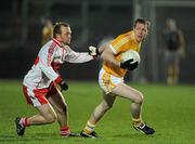 29 January 2011; Kevin Brady, Antrim, in action against Ciaran McGoldrick, Derry. Barrett Sports Lighting Dr. McKenna Cup Semi-Final, Derry v Antrim, Celtic Park, Derry. Picture credit: Oliver McVeigh / SPORTSFILE
