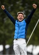 27 September 2016; Niall Horan celebrates a missed USA putt which resulted in a drawn match in the Celebrity Matches at The 2016 Ryder Cup Matches at the Hazeltine National Golf Club in Chaska, Minnesota, USA. Photo by Ramsey Cardy/Sportsfile