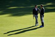 29 September 2016; Rory McIlroy of Europe speaks with his caddie JP Fitzgerald during a practice session ahead of The 2016 Ryder Cup Matches at the Hazeltine National Golf Club in Chaska, Minnesota, USA. Photo by Ramsey Cardy/Sportsfile