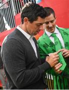 29 September 2016; Rory McIlroy of Europe signs autographs after the ninth hole during a practice session ahead of The 2016 Ryder Cup Matches at the Hazeltine National Golf Club in Chaska, Minnesota, USA. Photo by Ramsey Cardy/Sportsfile