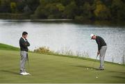 29 September 2016; Rory McIlroy, left, and Henrik Stenson of Europe practice on the seventh green during a practice session ahead of The 2016 Ryder Cup Matches at the Hazeltine National Golf Club in Chaska, Minnesota, USA. Photo by Ramsey Cardy/Sportsfile