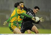 5 February 2011; Francis Quinn, Sligo, in action against Kevin Cassidy and Ryan Bradley, Donegal. Allianz Football League Division 2 Round 1, Donegal v Sligo, MacCumhaill Park, Ballybofey, Co. Donegal. Picture credit: Oliver McVeigh / SPORTSFILE